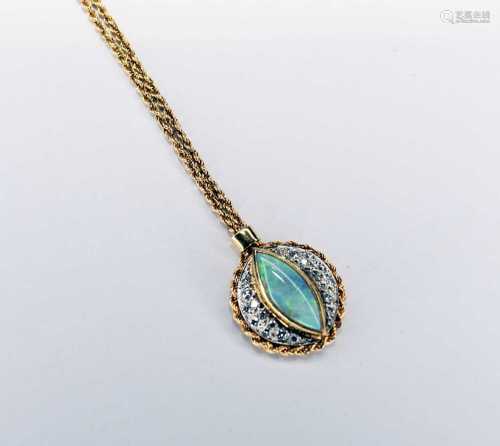 An 18ct gold opal and diamond pendant on chain