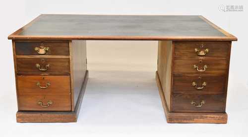 A large mid-20th century mahogany pedestal partner's desk