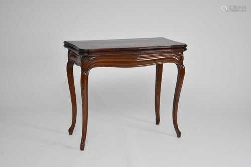 A late Victorian mahogany serpentine fold-over card table