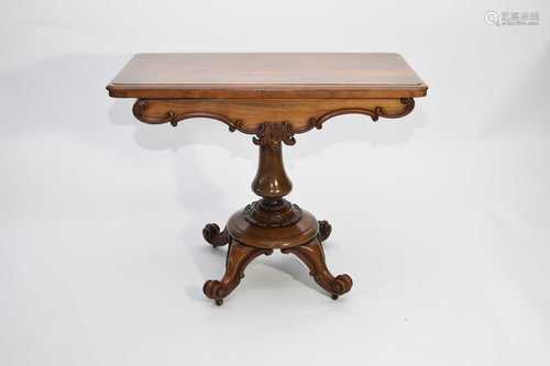 A Victorian rosewood fold-over card table