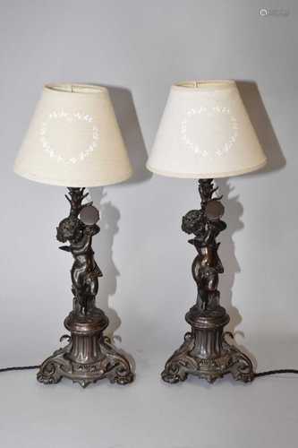 A pair of bronze figural table lamps