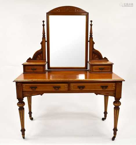 An Edwardian walnut dressing table of aesthetic movement tas...