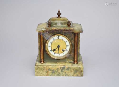 An Edwardian onyx mantel clock