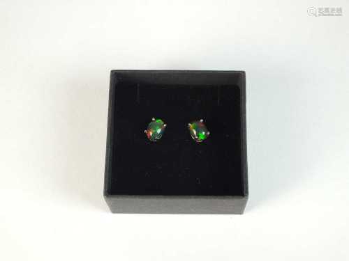 A pair of black opal studs earrings