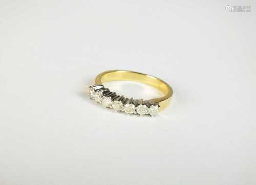 An 18ct yellow and white gold seven stone diamond ring