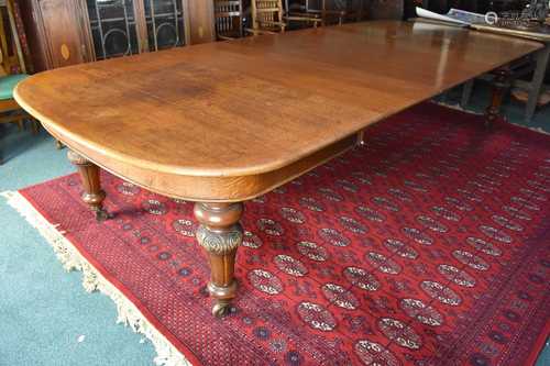 A large Victorian, natural oak, telescopic, extending dining...