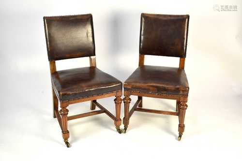 A set of 11, late 19th century, walnut dining chairs, by Gil...