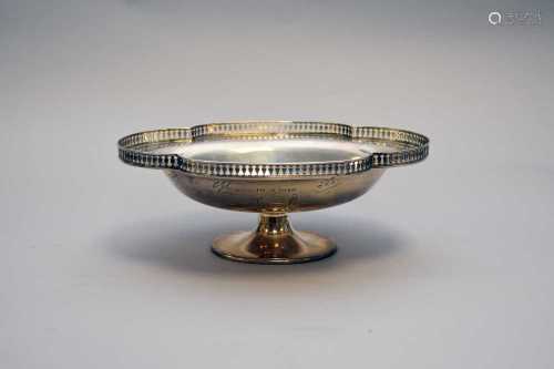 A silver pedestal lobed bowl