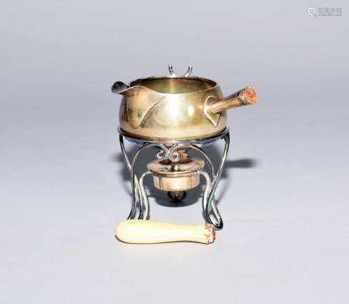 A miniature silver toddy pan on stand