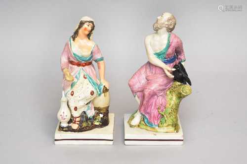 A pair of Staffordshire pearlware figures of Elijah and the ...