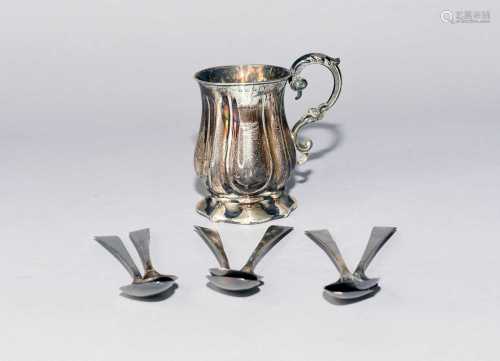 A silver mug and teaspoons