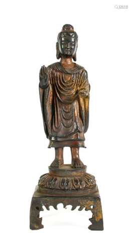 A Chinese Bronze Figure of Buddha, 18th/19th century, standi...