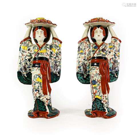 A Pair of Japanese Porcelain Figural Candlesticks, Meiji per...