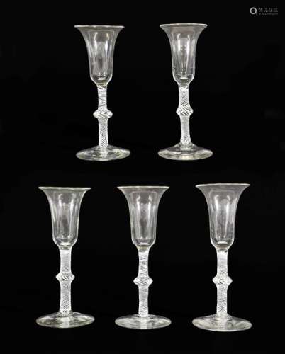 A Set of Five Wine Glasses, circa 1750, the bell shaped bowl...