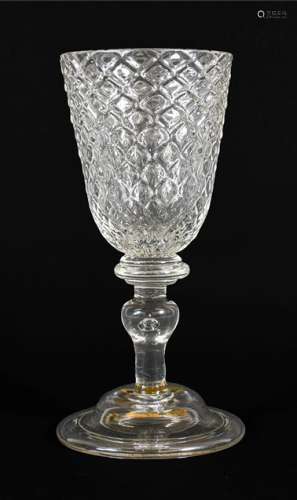 A Glass Goblet, circa 1730, the rounded funnel bowl moulded ...