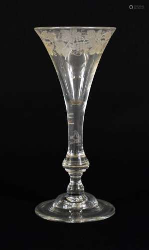 A Wine Glass, 1740, the drawn trumpet bowl engraved with fru...