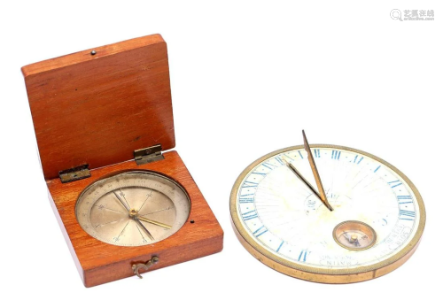 Compass in wooden box and stones