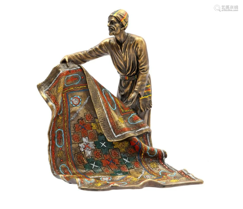 Bronze sculpture of an Arab with carpet