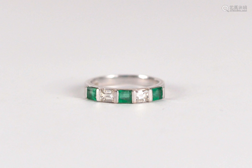 18 kt white gold semi-eternity ring set with emeralds