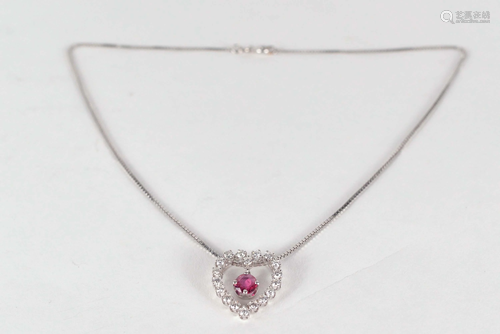 14 kt white gold heart shaped pendant set with garnet