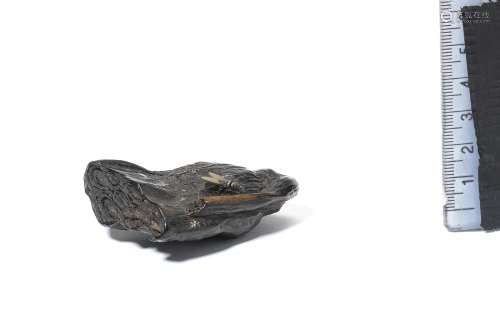 A kurogaki (black persimmon) wood netsuke of a lotus-seed po...