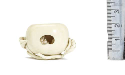 An ivory netsuke of a mikan (Japanese orange) By Hosai Masah...