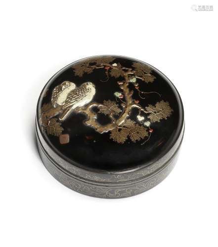 A black-lacquer circular kagamibako (mirror box) with en-sui...