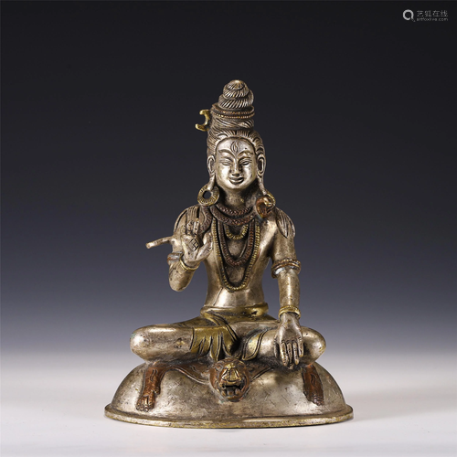 A CHINESE SILVER GILT SEATED FIGURINE OF BUDDHA