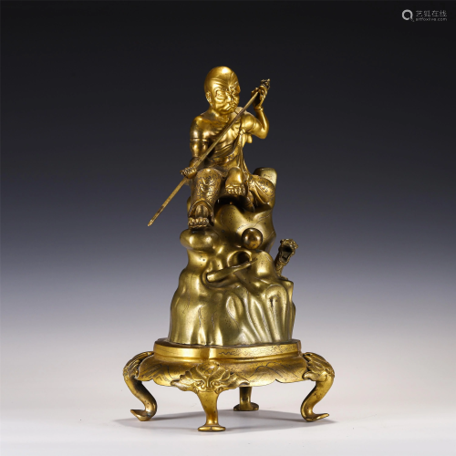 A CHINESE GILDING FIGURINE OF ARHAT