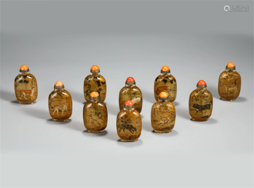 TEN CHINESE GLASS SNUFF BOTTLES WITH DOGS AND