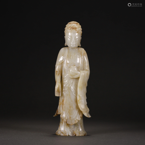 A CHINESE JADE CARVED STANDING FIGURINE OF SHAKYAM…