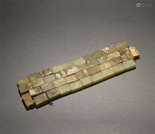A STRING OF CHINESE INSCRIBED JADE RECTANGULAR BLO…