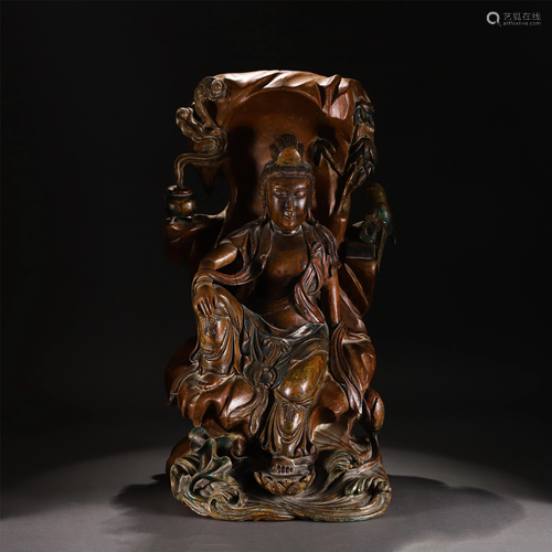 A CHINESE CHENXIANG WOOD CARVED FIGURINE OF GUA…