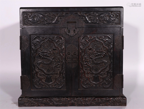 A CHINESE ZITAN WOOD STORAGE BOX CARVED WITH DRAG…