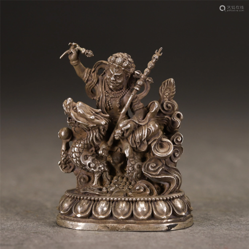 A CHINESE SILVER FIGURINE OF BUDDHA AND DRAGON