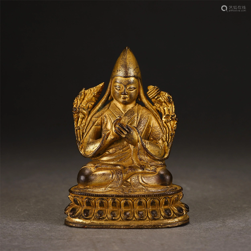 A CHINESE GILT BRONZE SEATED FIGURINE OF GURU