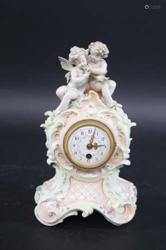 GERMAN PORCELAIN MANTLE CLOCK a late 19thc or early 20thc po...