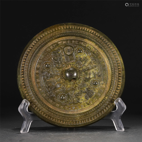 A CHINESE BRONZE MIRROR WITH CARVINGS