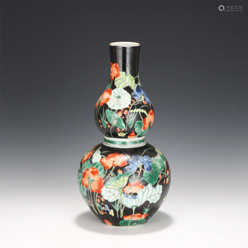 A CHINESE POLYCHROME LOTUS PORCELAIN DOUBLE-GOURDS…