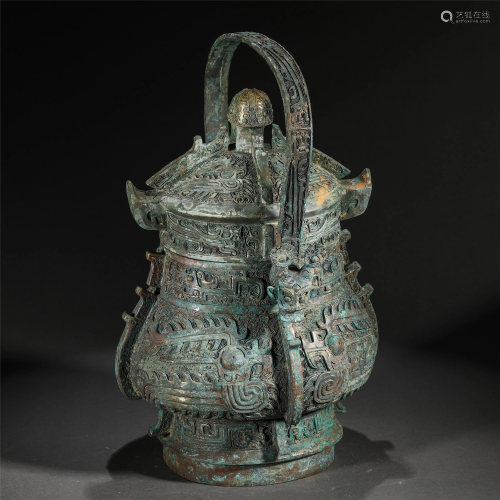 A CHINESE BRONZE RITUAL VESSEL WITH LOOP HANDLE