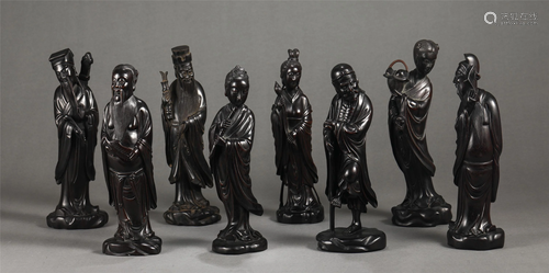 A GROUP OF CHINESE HARDWOOD FIGURINES OF EIGHT