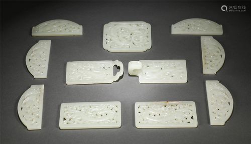 A SET OF CHINESE CARVED JADE BELT BUCKLES