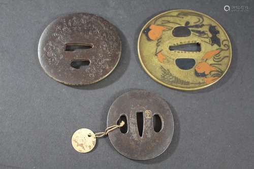 JAPANESE TSUBA a circular iron tsuba, with a depiction of a ...