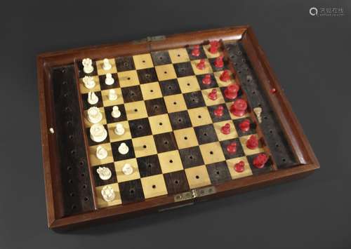 JAQUES TRAVELLING CHESS SET a mahogany cased folding chess b...