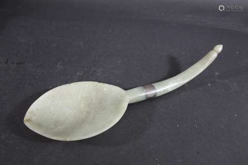 JADE SPOON possibly Qing Dynasty, 19thc, of curved shape wit...