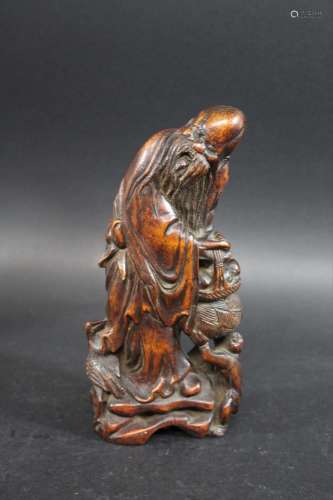 CHINESE BAMBOO CARVING a carved bamboo figure of Shou Lao, G...