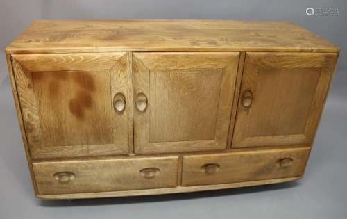ERCOL SIDEBOARD a light elm sideboard with a two door cupboa...