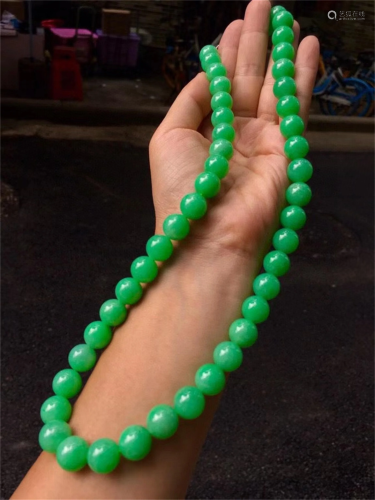 A Chinese Carved Jadeite Necklace