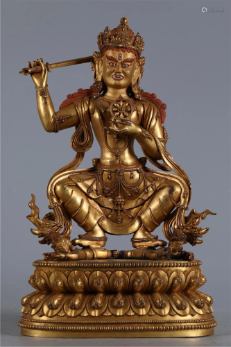 A GILT BRONZE DHARMA-CAKRA VAJRA BUDDHA STATUE