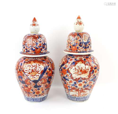 Pair of Japanese Imari vases and covers decorated with flowe...